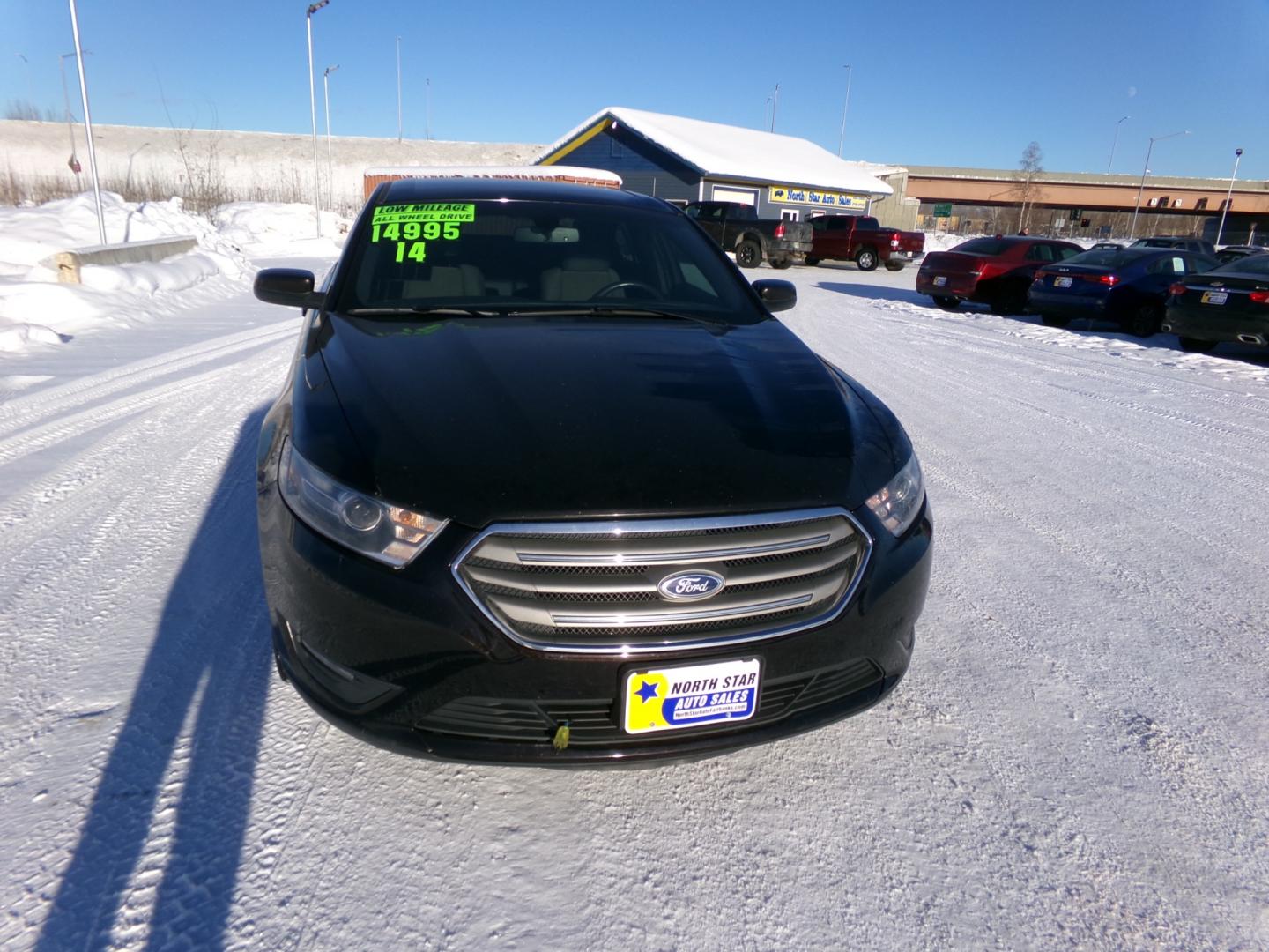 2014 Brown Ford Taurus SEL (1FAHP2H85EG) with an 3.5L V6 DOHC 24V engine, 6-Speed Automatic transmission, located at 2630 Philips Field Rd., Fairbanks, AK, 99709, (907) 458-0593, 64.848068, -147.780609 - Photo#1